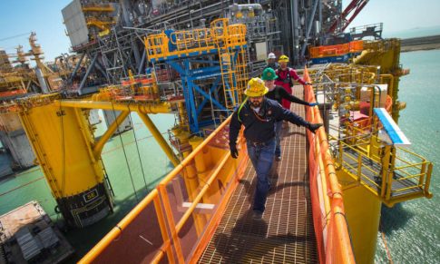 U.S. crude oil rises 3% on weaker dollar, slightly improved 2024 demand outlook